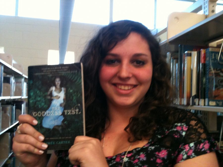 Serafina Sicignano holding up one of the titles she talked about!