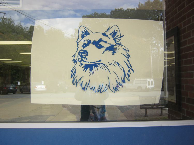 Husky at the entrance to The Morgan School