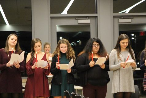 Students reading the induction pledge