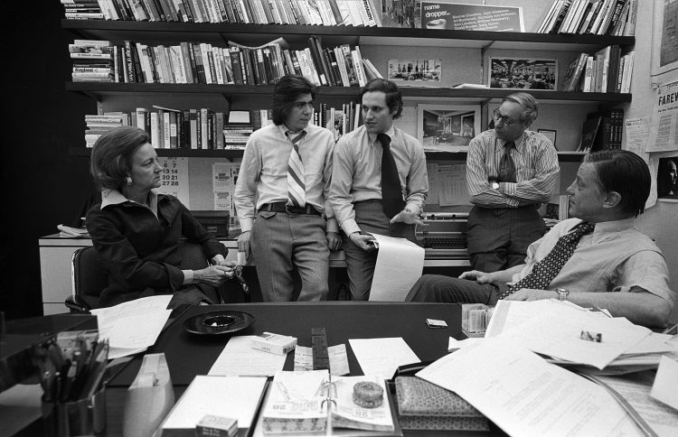 Washington Post publisher Katharine Graham with reporters Carl Bernstein, Bob Woodward, editor Howard Simons discuss the Watergate story in Post managing editor Benjamin C. Bradlee in Bradlees office at the Washington Post, April, 1973.