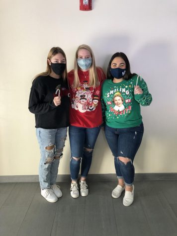 Regan Franzoni, Madelyn Dunham, and their other friend in their best ugly sweaters showing some holiday spirit