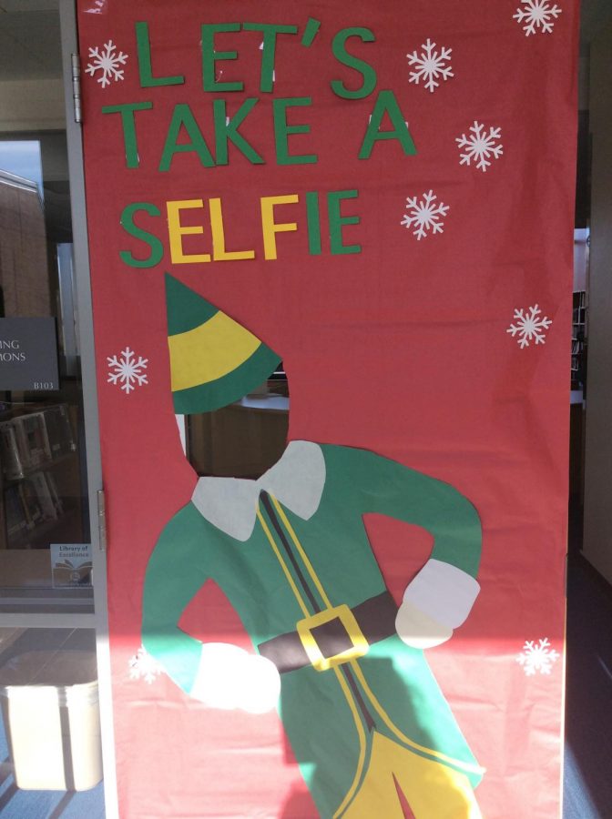 A decorated door with an elf