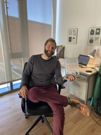 English teacher Eric Carroll holds a book