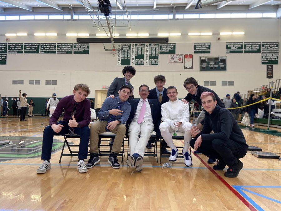 Morgan fencers convene with freshman Anthony Strunjo before the mens epee pool round begins