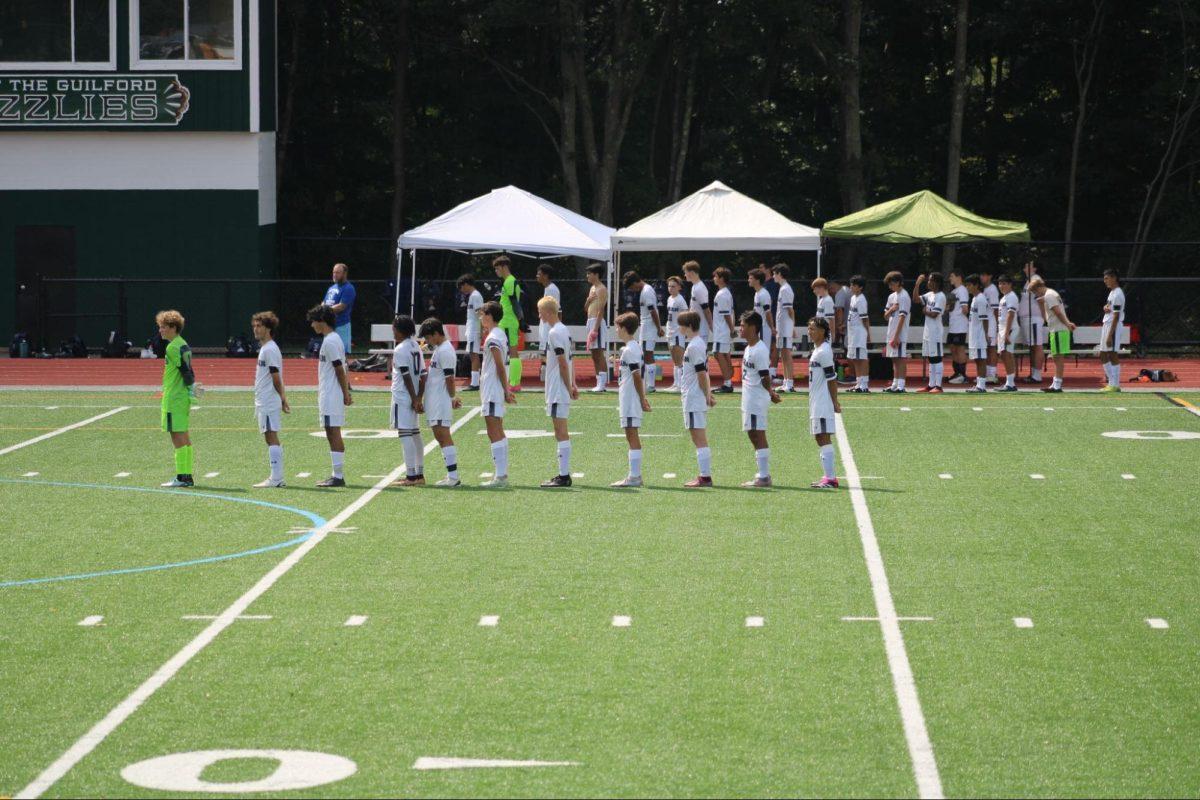 Morgan Boys Soccer Stands For The National Anthem.