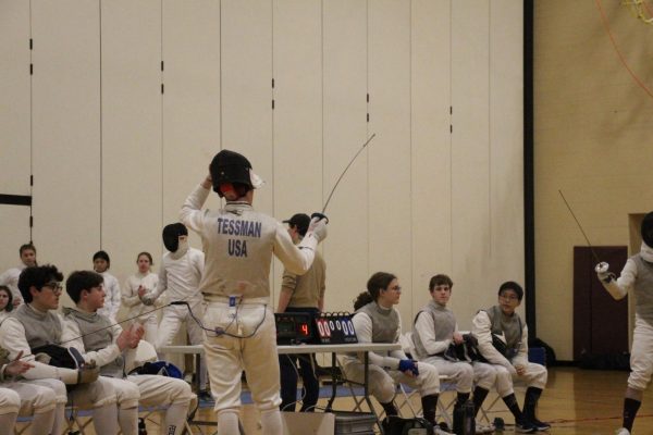 Henry Tessman getting ready to Fence