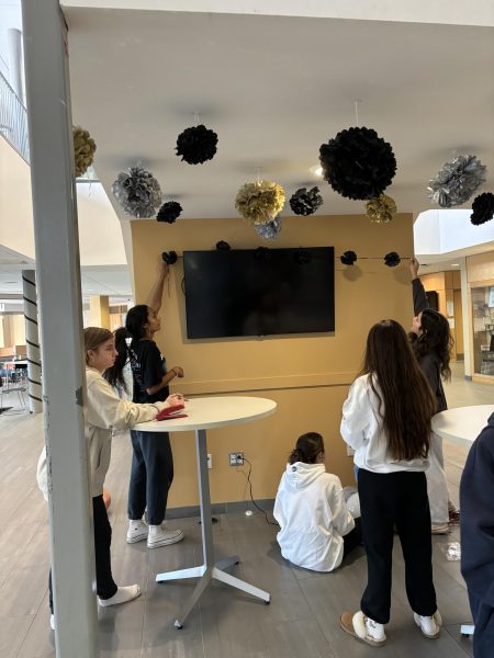 Students hanging decorations