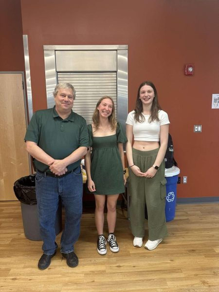 Staff Member Robert Walling, Seniors Gavin Gersz, and Victoria ONeill wearing green to kick off the Environmental Spirit Week