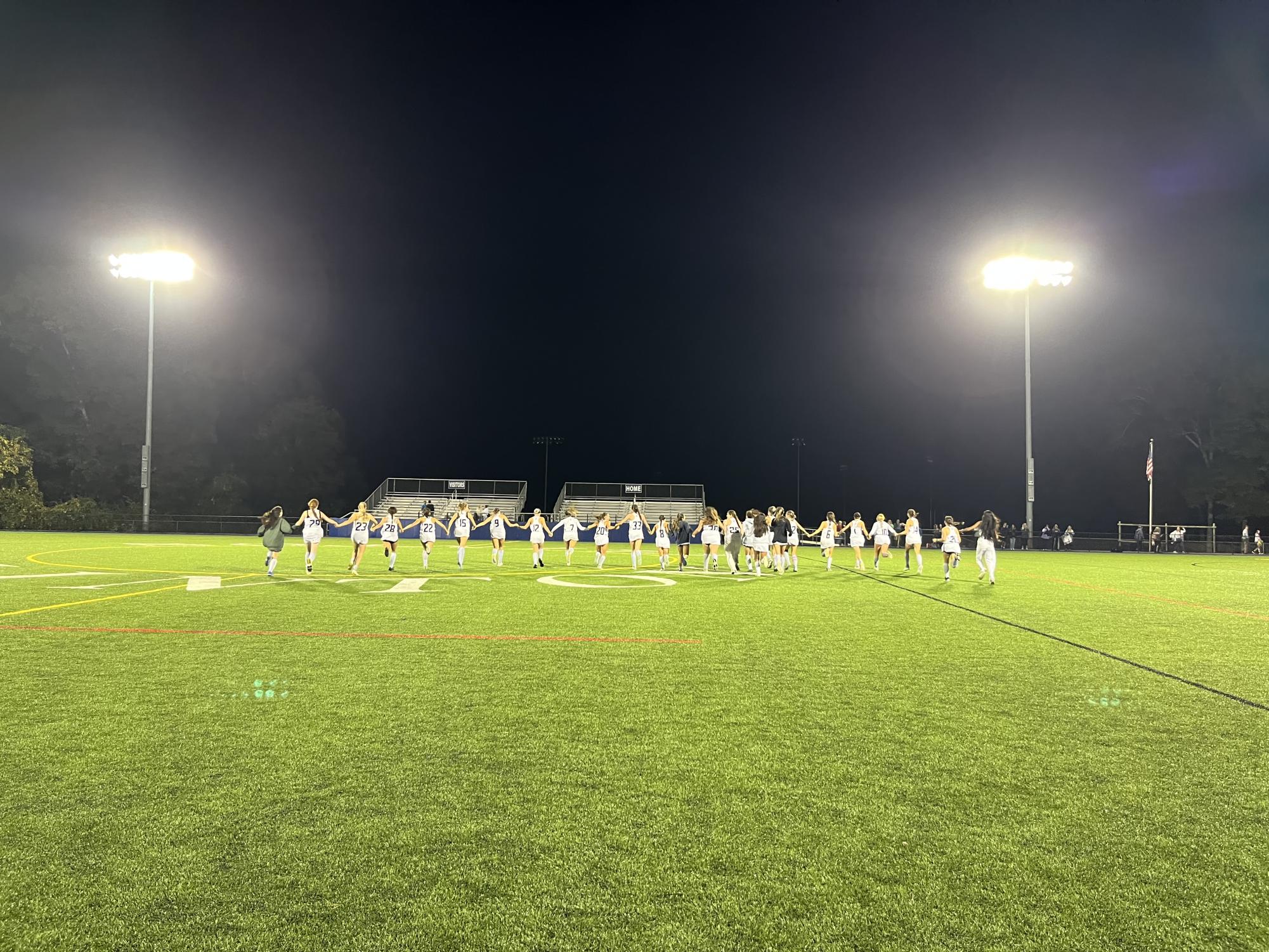 The Field Hockey Team does victory run, after a win.