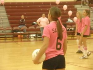 Samantha Tropiano playing volleyball in high school