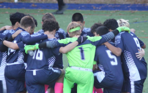 The Morgan Boys soccer team huddled together