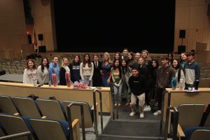 Pictured are Morgan students posing with New 8 reporter Laura Hutchinson.