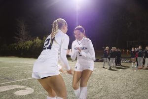 Jacquelyn Ciarleglio and Mia Zhiminaicela doing handshake at starting lineup announcements