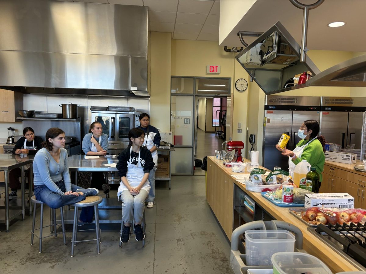 The FCCLA and Spanish clubs learning to cook arepas. 