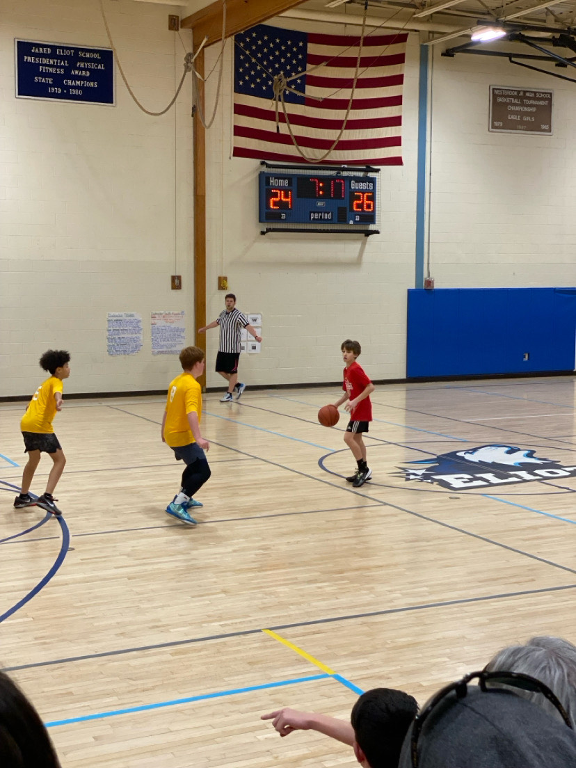 Dylan Miller (Red) against two yellow players