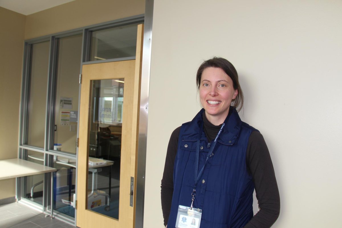 Mrs. Latham standing in front of the Learning Commons.