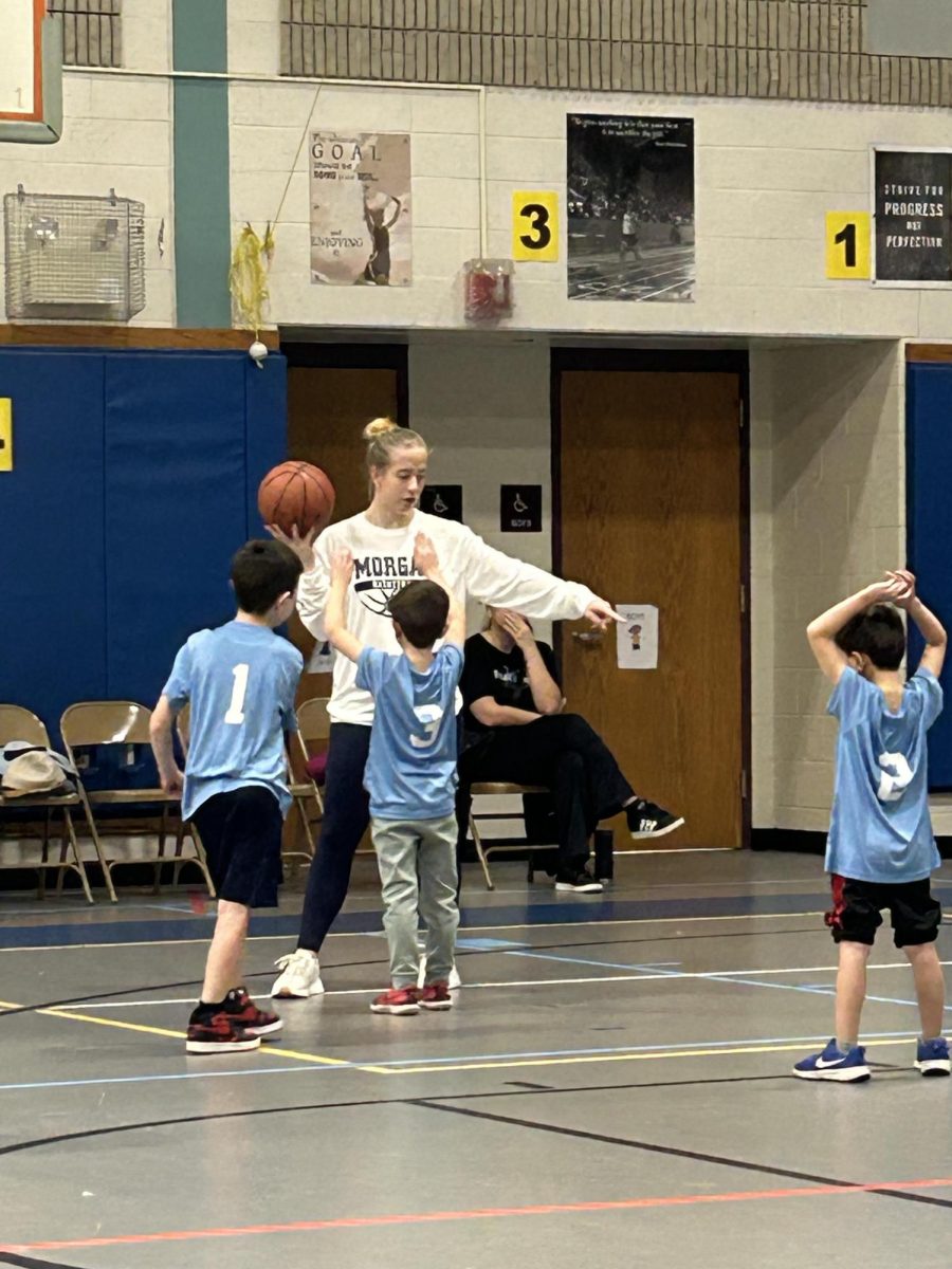 Senior Cora Dunham coaching her 1st and 2nd grade Co-ed team