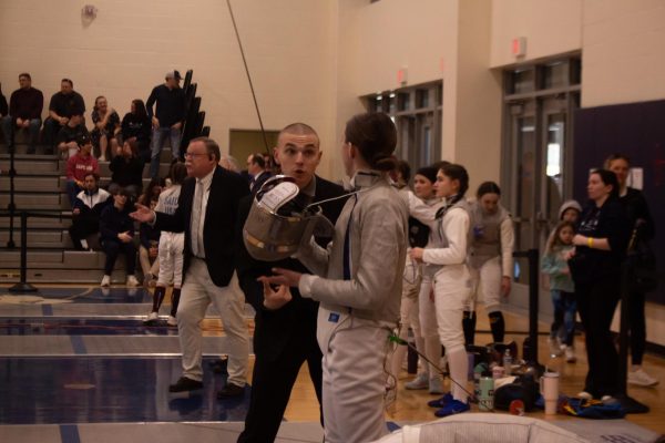 Saber Coach Alex Rauccio coaching Sophomore fencer Molly O'Donnell