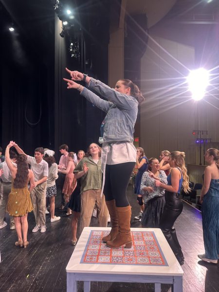 Mrs. Robinson hyping up the cast of Mamma Mia for their performance 