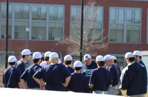 Morgan Team Huddle with Coach Trevor Brown