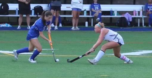 Julia Shove playing field hockey