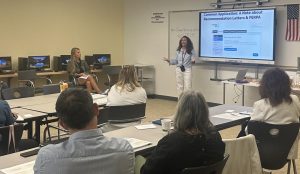 Mrs. Zdunczyk speaking with faculty.