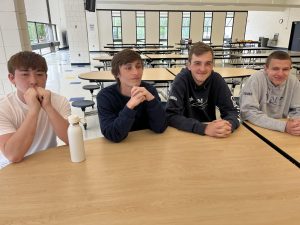 Some of the Trivia Bowl members sitting at a table, getting ready to participate in the shoreline trivia tournament.