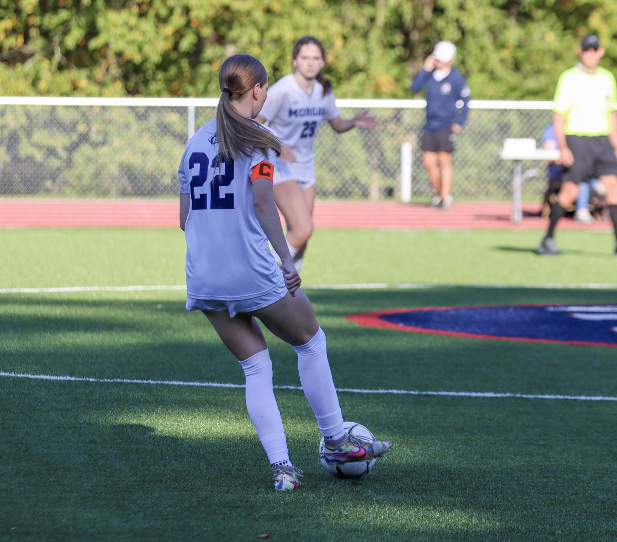 Riley Febbroriello passing the ball to a teammate