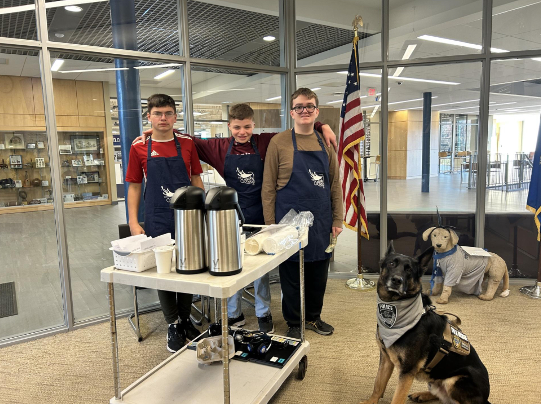 Students from the Intensive Learning program setting up to sell coffee for staff, taken from the weekly blast