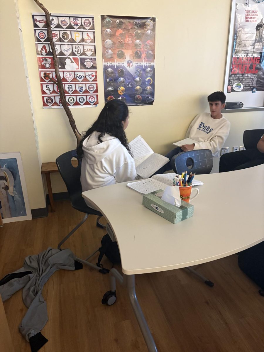 Freshmen Katelyn Ramirez talking with classmate.