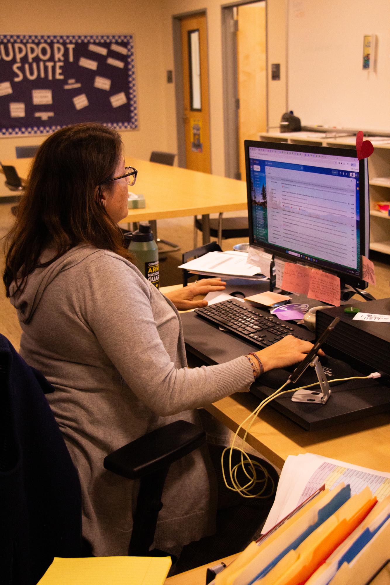 Mrs. O'Beirn sitting at her desk in the guidance office. She oversees several of the programs aimed at helping seniors plan for the future. 