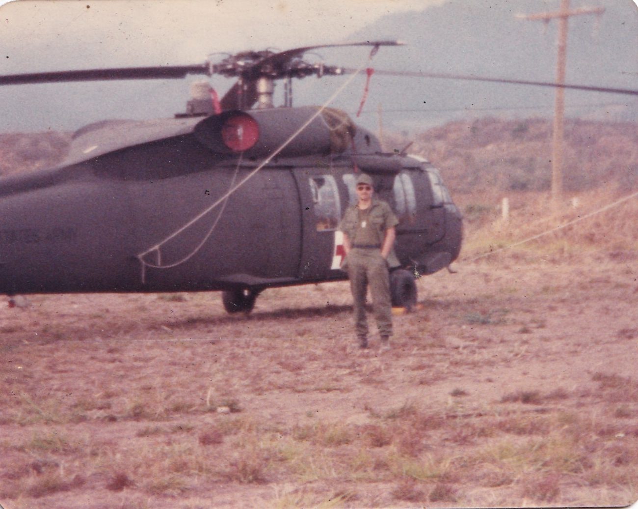 Mr. Walling next to a new Blackhawk Helicopter.