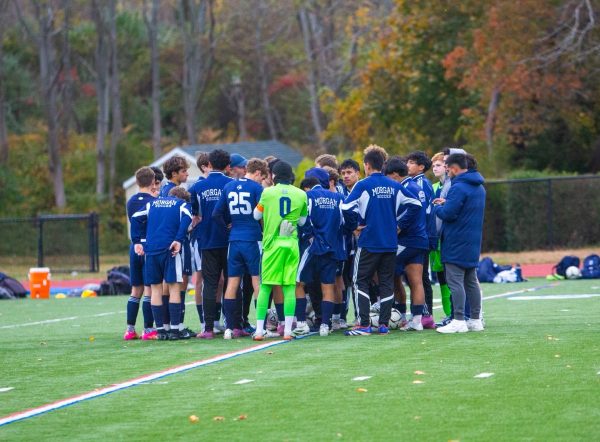 Morgan boys soccer huddles before the championship match
