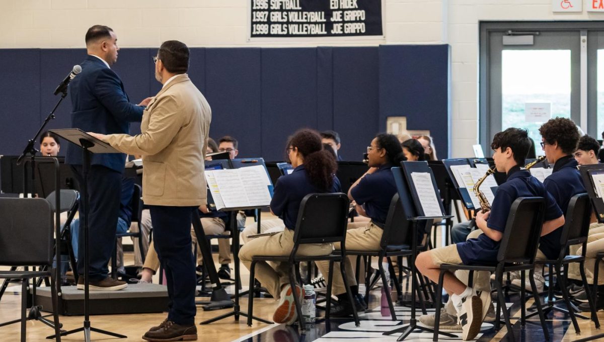 Orduz conducting at the Veterans day assembly
