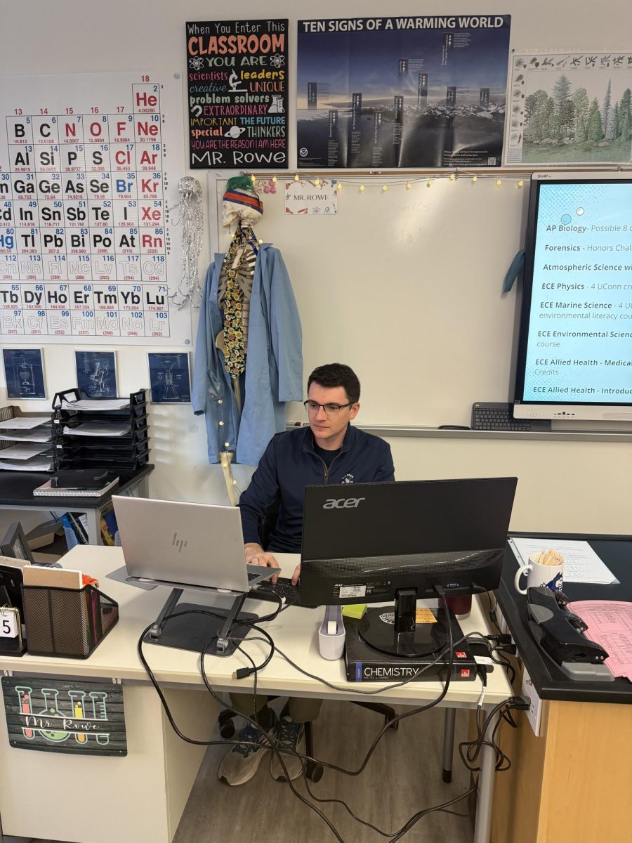 Mr. Rowe working at his desk