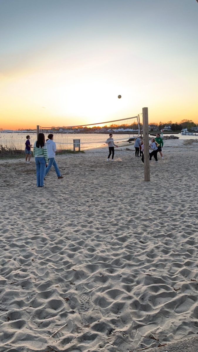 French exchange students playing volleyball at the beach