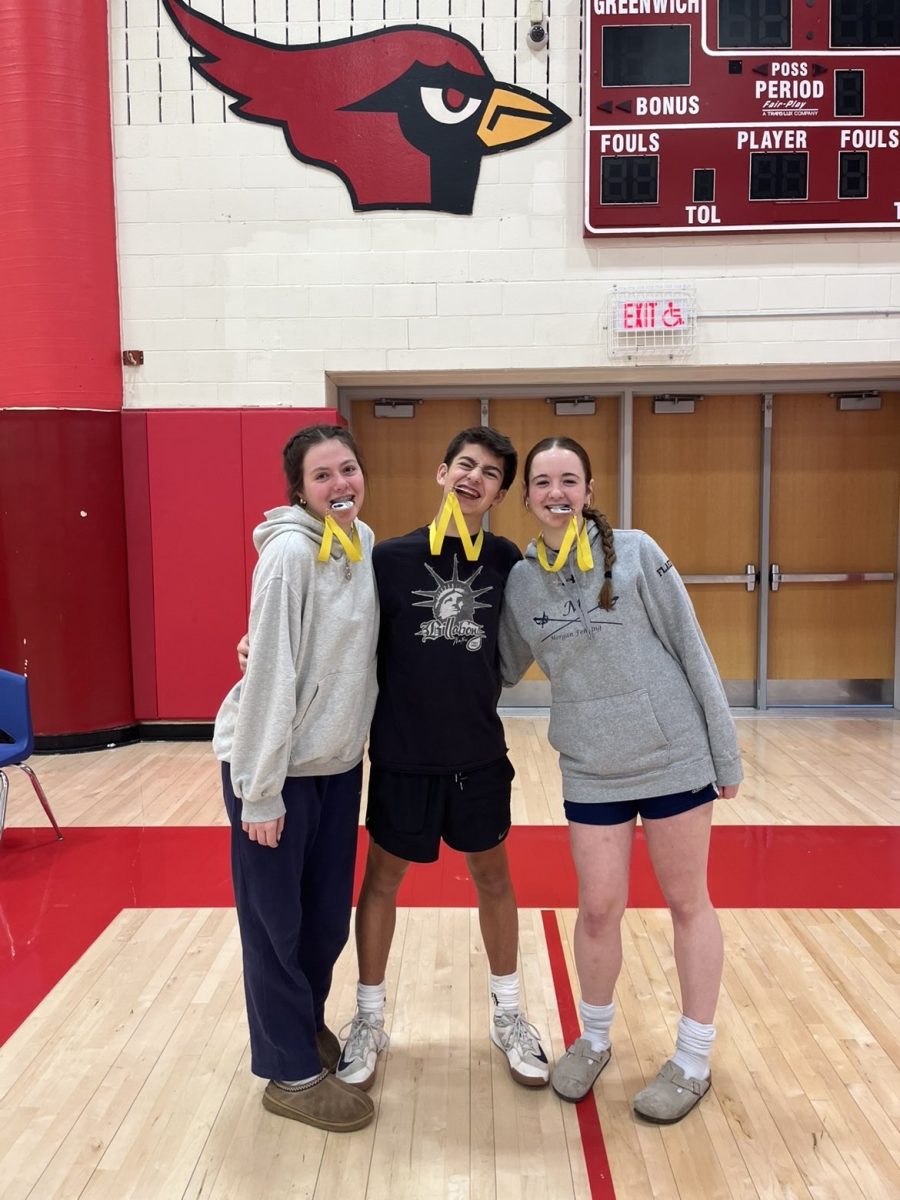 Saoirse O'Beirn, Hendrick Bausch, and Lena Flaherty celebrating with their medals
