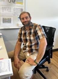 Richetelli sitting calmly at his desk. 
Photo taken on September 28, 2022