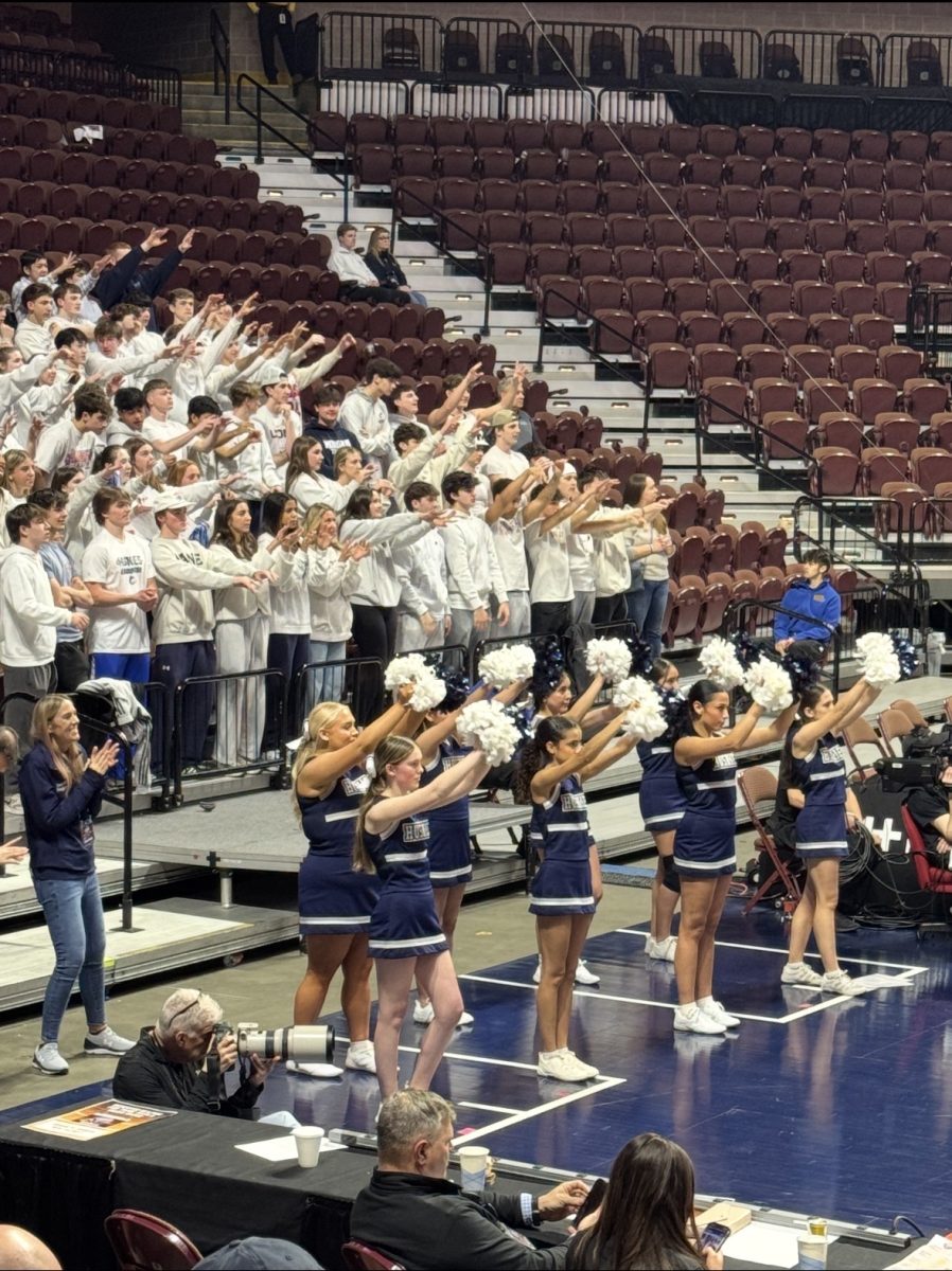 Cheerleaders cheering at the Morgan Girls State Basketball Championship.
