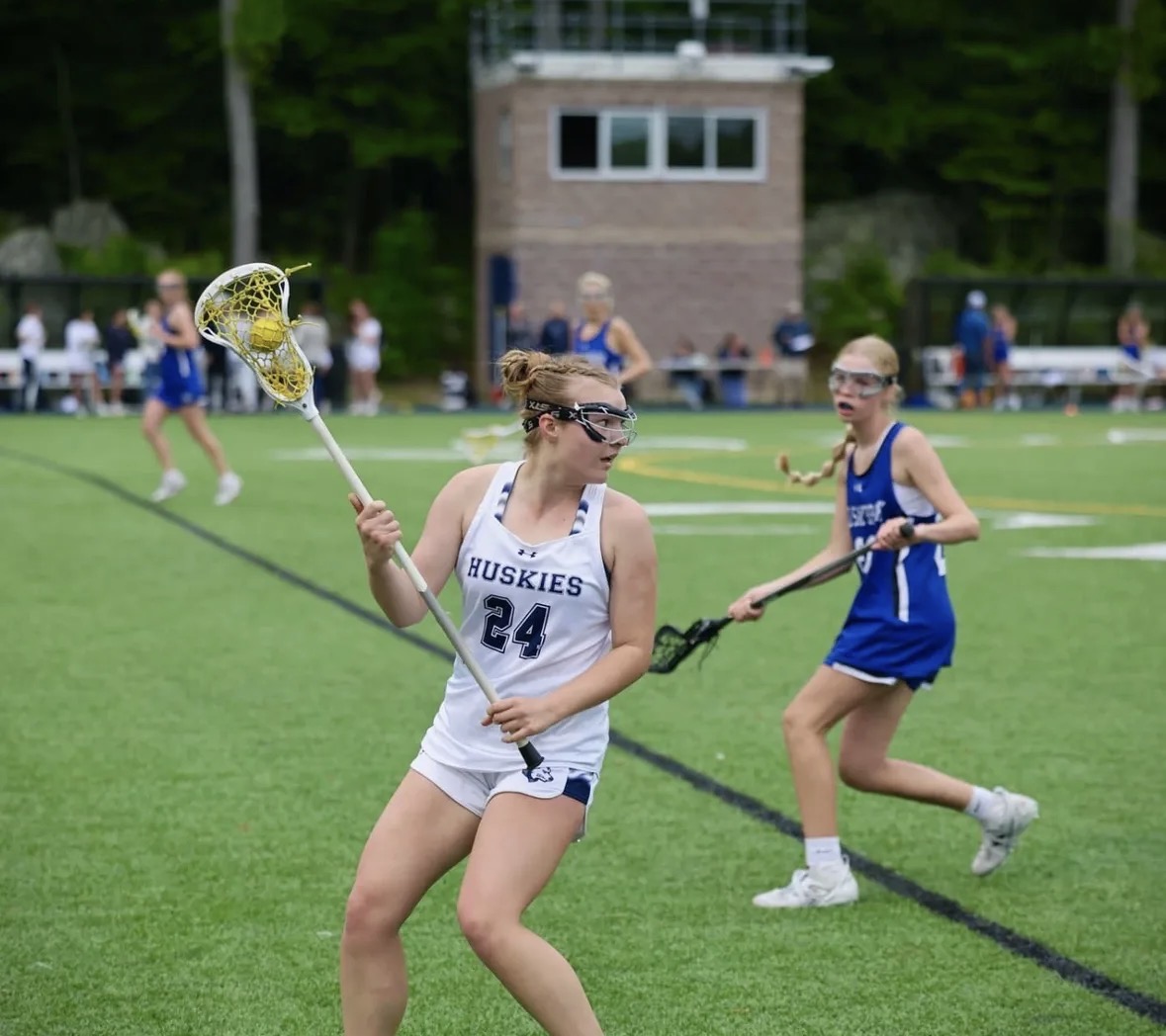 Emerson Dunning playing lacrosse for Morgan