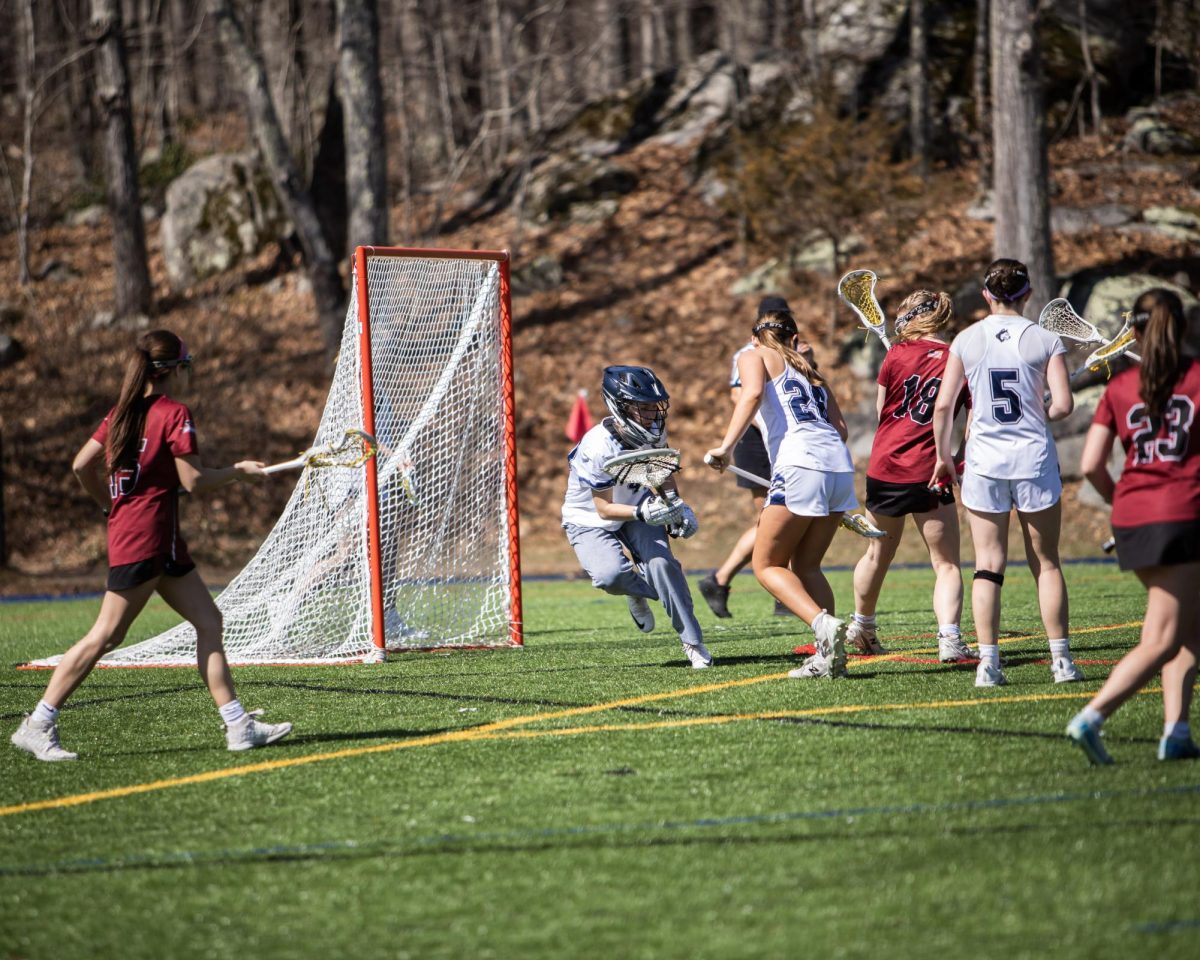 Junior Annabelle Parent going to spot the shot from going into the goal