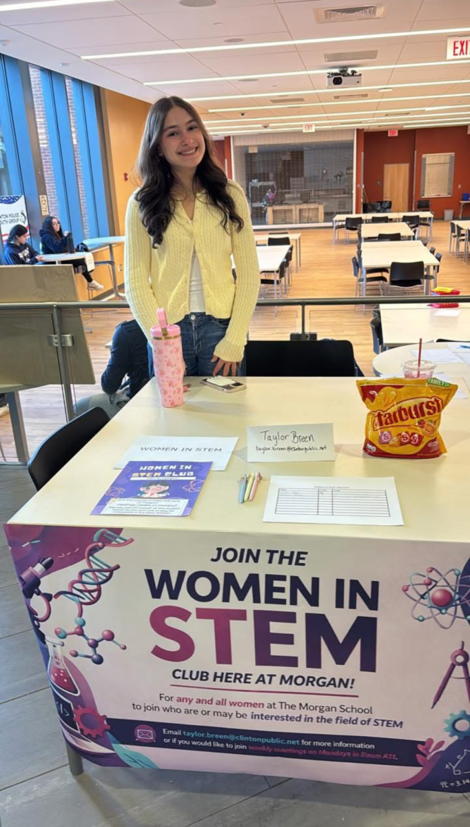 Junior Taylor Breen encouraging 8th graders to join the Women in STEM club at 8th grade open house