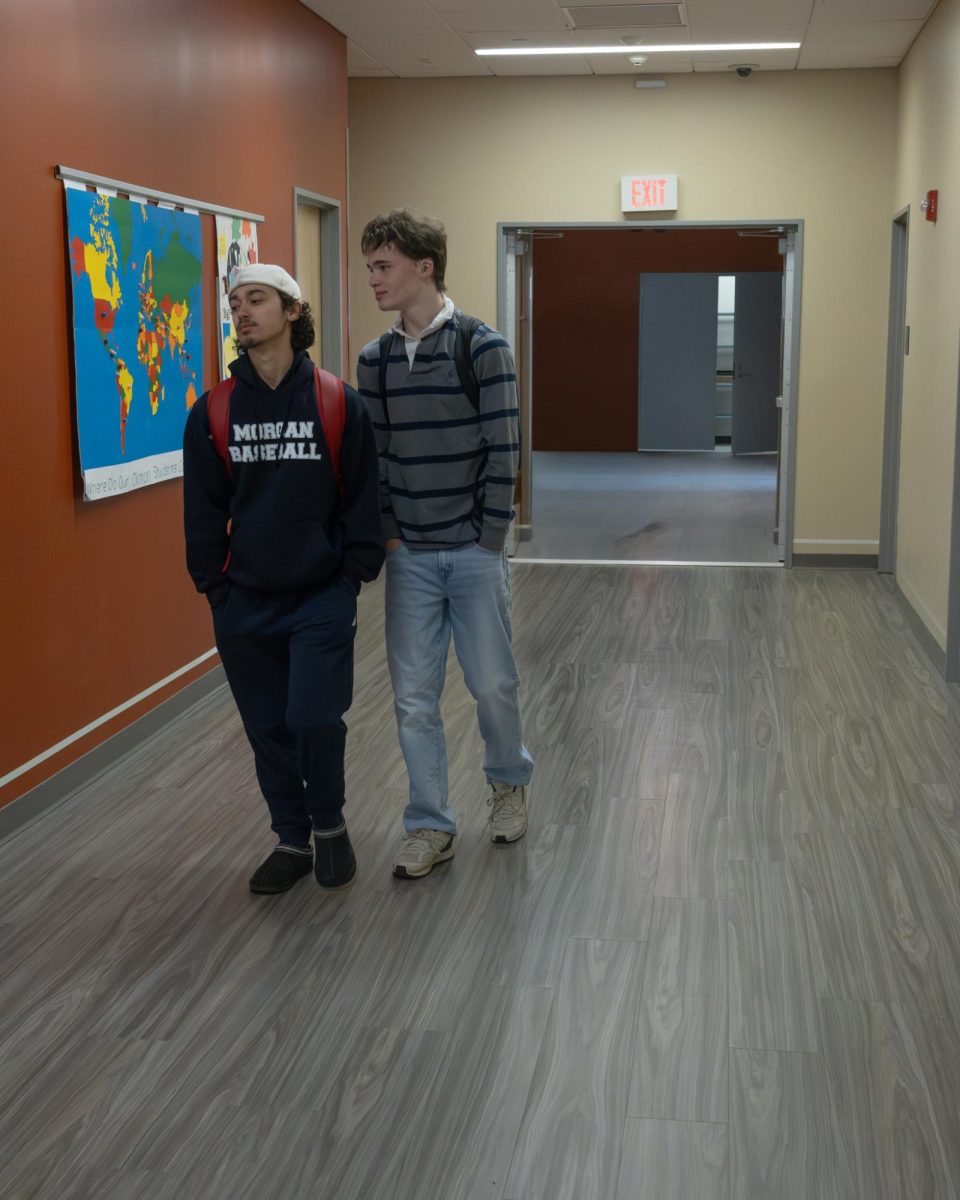 Students from The Morgan School walking through the halls during spirit week in regular, non-spirited outfits.