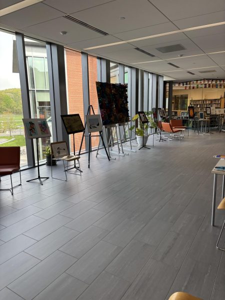 Art work being displayed in the upper hub at the Creative Arts Expo