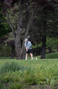 Landon Coley getting ready to hit a ball on the course