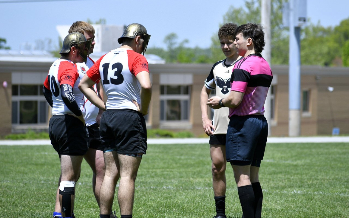 Seniors Michael Capalbo, Sean Bourgeois, and Steven McCleary at the coin toss 