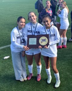 Photo of Addy Massey, Colbie LeClaire, and Katelyn Ramirez holding the  State Title plaque.